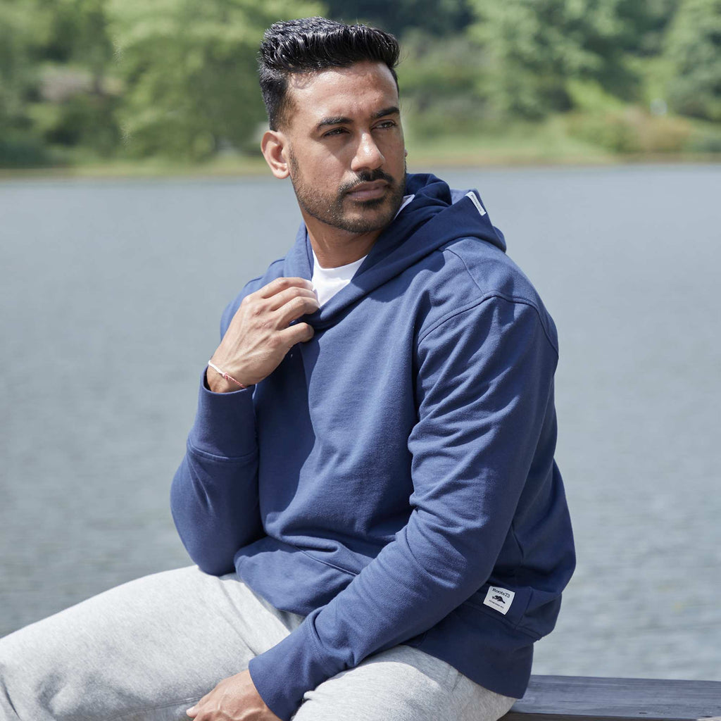 Roots73 Canmore Eco Pullover Hoodie, Unisex Transfer - Indigo Blue - Left Angle On Model 3